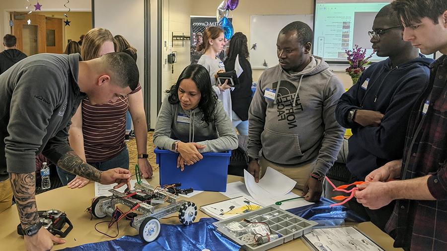 coding and robotics team assembling robot